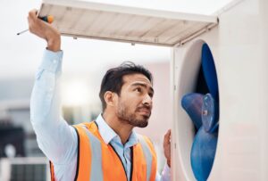 technician inspecting fan