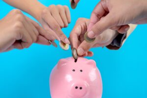 saving money in a piggy bank