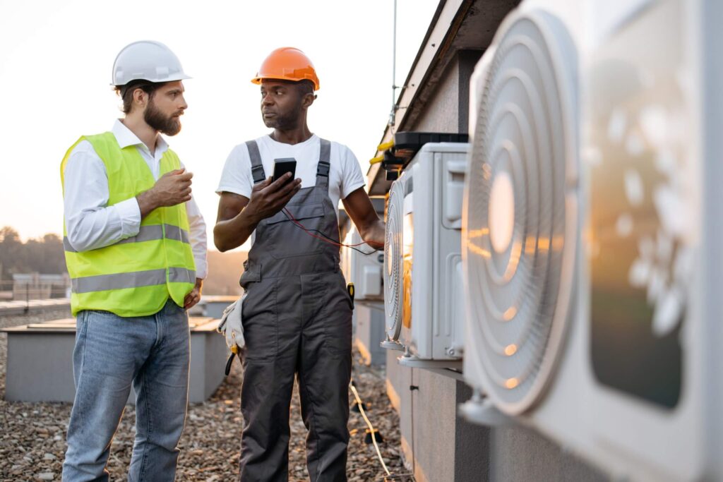 two men discussing HVAC system