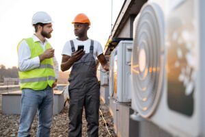 two men discussing HVAC system